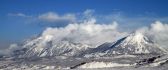 Mountain peaks in clouds HD wallpaper