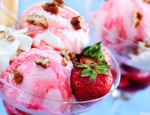 A cup full of ice cream with strawberries - delicious