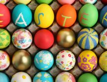 A box of colored eggs - Message: Happy Easter