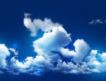 Fluffy clouds on a beautiful blue sky - HD wallpaper