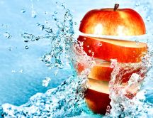 Apple cut in one shot - macro splash water