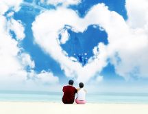 Romantic holiday at seaside - big cloud in heart shape