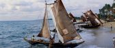 Old sailboats bring food - people fishing on the sea