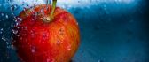 Splash red apple - macro delicious fruit full of vitamins