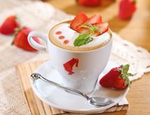 Fresh summer coffee with strawberry and mint
