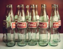 Empty Coca Cola bottles - delicious juice