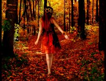Beautiful lady in the middle of forest - autumn season
