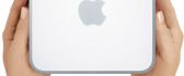 Apple Mac Mini in the hands - Apple logo