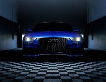 Blue Audi RS 5 in a dark space - Car wallpaper