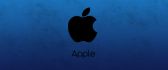 Black apple emblem on blue background