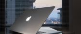 Gray Apple MacBook on a table - Apple wallpaper
