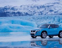 Beautiful blue Volkswagen car on the ice - winter wallpaper
