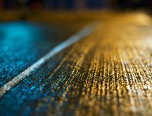 Beautiful texture on the road in the blue and yellow light