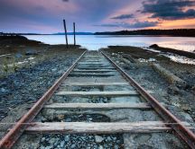 Old and rusty rails go on the sea - HD wallpaper