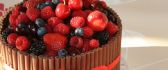 Delicious chocolate cake with berries and strawberries