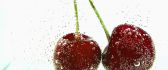 Two cherries in mineral water - bubbles