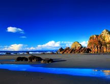 Wonderful blue water and big rocks - beautiful wild beach