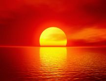 Big golden ball - summer sunset over the ocean