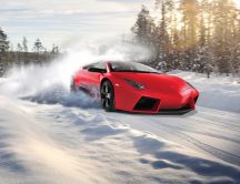 Red Lamborghini drift in the snow - White winter season