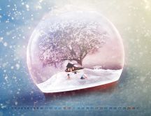 Winter season in a crystal globe - December month