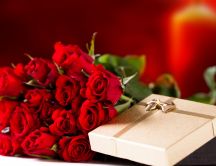 Golden gift box and a wonderful bouquet of red roses