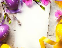 Yellow and purple Easter eggs on the table - Happy Spring