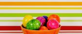 Easter eggs in a basket - Colorful background