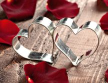 Red petals of rose and two hearts of love - Valentine's Day