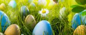 Easter eggs in the green Spring grass - Happy Holiday