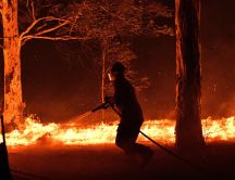 Fireman works to stop the big fire in Australia -Forest burn