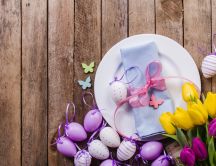 Purple Easter eggs and beautiful tulip flowers - Spring time