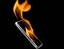 IPhone on fire - Black wallpaper and dark background
